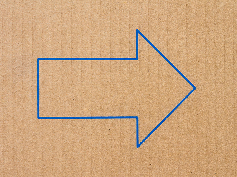 An arrow on a piece of cardboard